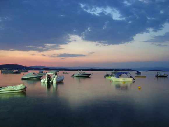 Beautiful sunset in harbor of Nikiti ...