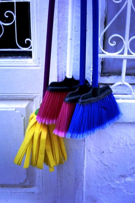 Colourful brooms for sale