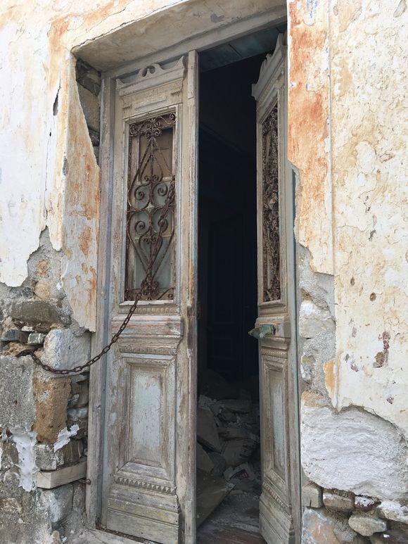 This is not a simple door to a modest home, notice the detail in the woodwork. The open door was pleading to me to step inside and admire. I did just that and stood there imagining what life had been like in this once beautiful home.