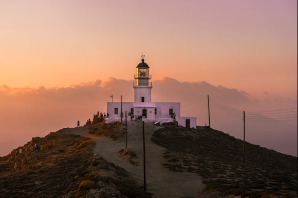 Lighthouse, Mykonos, breathtaking sunset. 