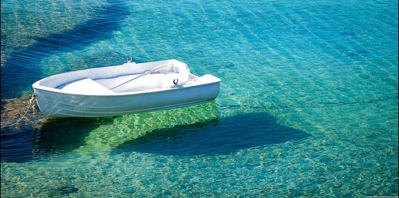...white boat, aqua water...