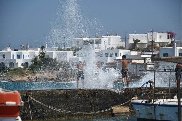 I usually avoid photographing people, but this one I could not resist. Young, brave and crazy boys in Naousa, Paros