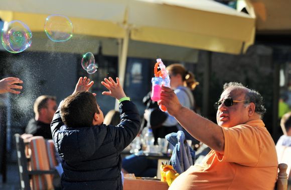 This man has been selling soap bubble machines for all the years we've been there. The kids love it when he sends soap bubbles across the square.