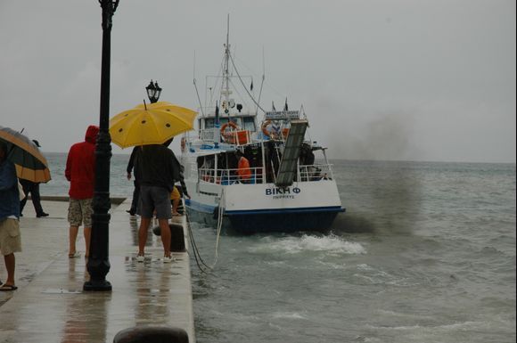 This boat had been out with tourists, but could not dock due to the weather, too much wind. 