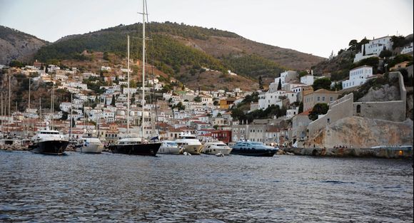 In the glow of the remnants of the sunset, we arrive at Hydra harbor after a wonderful boat trip at sunset.