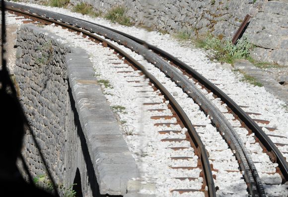 Gears in the middle of the train rails to help the train up steep hills