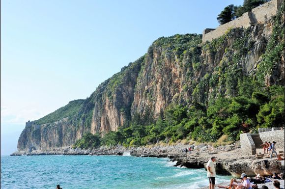 Arvanitia beach is very close to the city and part of the beach promenade around the mountain where Arconalphia Fort is at the top.