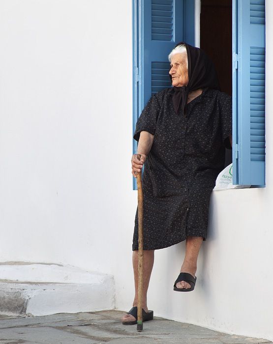 Woman in window - Hora, Naxos.
(I\'m trying, Ali!)