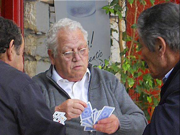 Men playing cards in Filoti