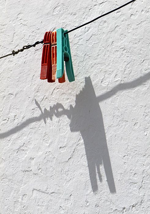 Clothes pegs and shadow.