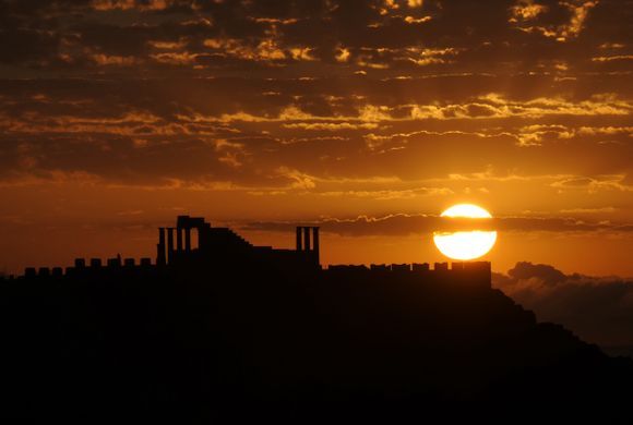 The Sun rise over the Acropolis in Lindos 