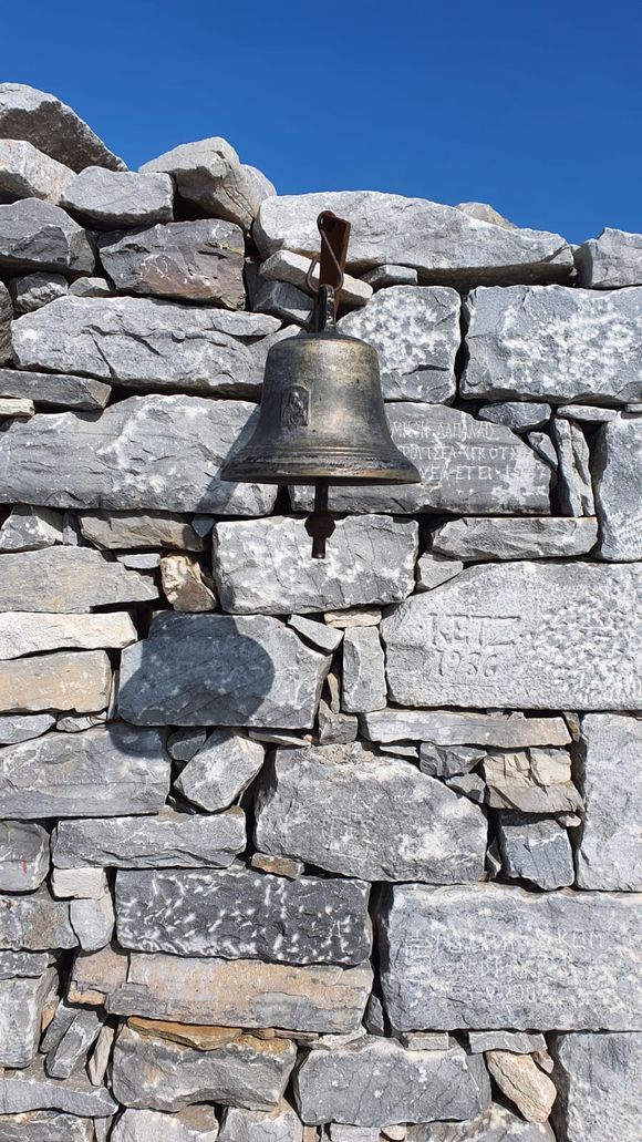 Ringing the bell on top of Profitas Illias. The highest peak Of Mt. Taygetus