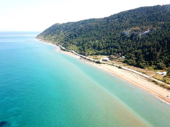 Mathraki Island unspoiled beach! The sand barrier creates warmer water by the seashore, great for families.