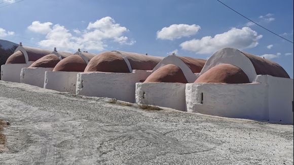 The back side of the 6 Churches in the village of Panagia on the island of Kasos. 
Here you can see the brown/red coloured domes well. 
I thought it was impressive and there's a special atmosphere here. 

October 6, 2021