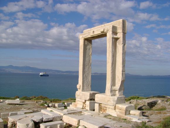 the remains of Apollo Temple's entrance - the so-called 'Portara' - in the harbour of Naxos town.