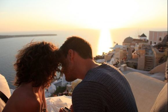 Oia, Santorini. Two lovers' silhouettes. Life is about moments. This moment, only in Hellas.