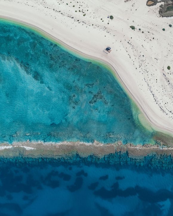 Aerial Landscape of a beach next to Agia Mavra Castle of Lefkada. The name of the location is called Vaya. 