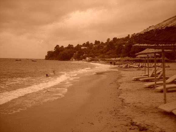 Sepia, retro style image of Troulos beach in Skiathos island, just before the storm in early fall.