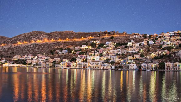 The  picturesque Symi island with the traditional colorful houses is one of the most depicted settlement in Greek island postcards!