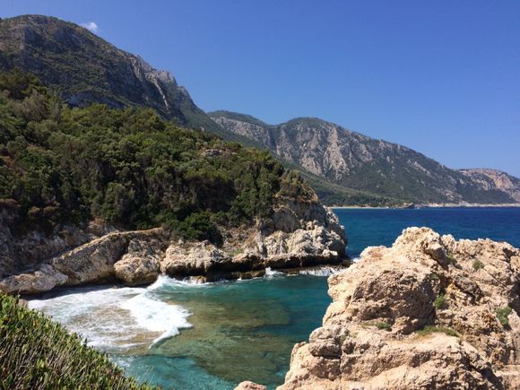 A nice hike through the woods and some olive groves brings you to this beautiful beach.
