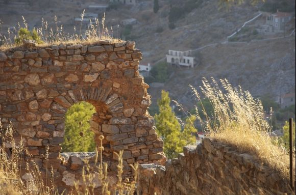 Contemporary ruins backlit by the early morning sun on the way to the Prophet Elias Monastery on Hydra, July 2012.