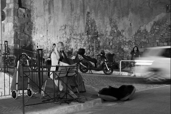 Constant cello player in Chania downtown