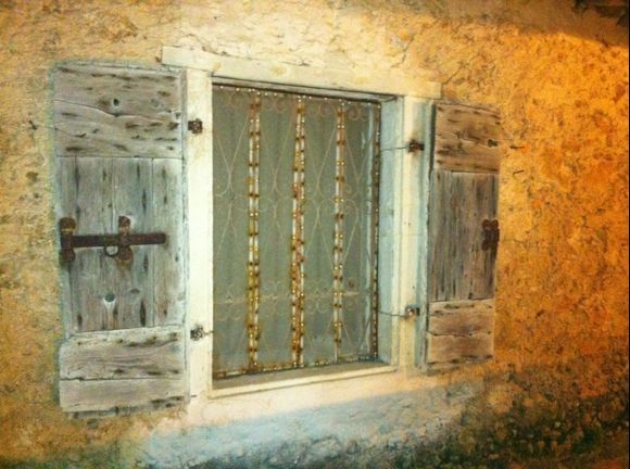 Village home window in the village of Agios Nikitas, Lefkada, Greece
