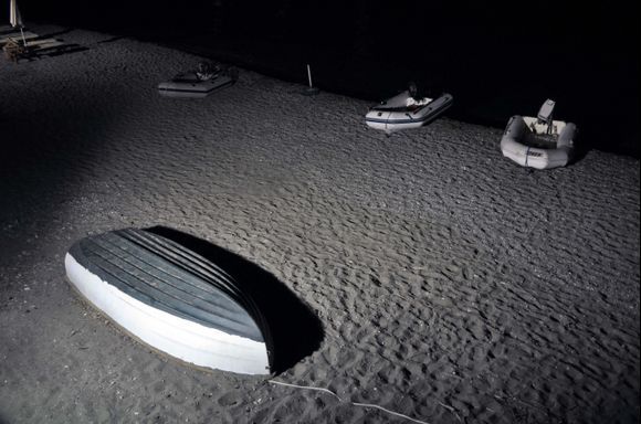 Small boats on Vromolithos beach, visitors from the sailboats in the bay, to Taverna Paradisos