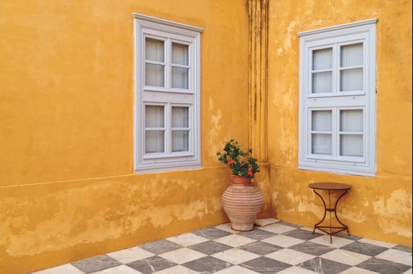 yellow mansion in hydra