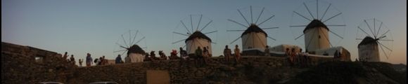 Panoramic view of windmills on the sunset