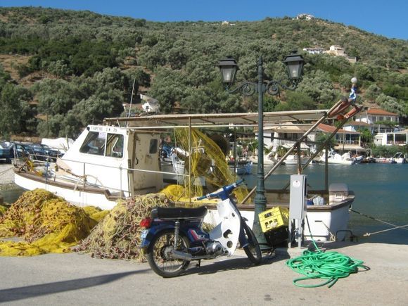 Boat, motor byke and water hose.