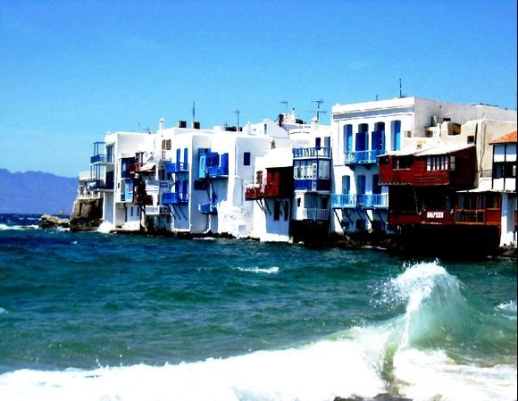 Little Venice of Mykonos, with the sea crashing at its doorstep.