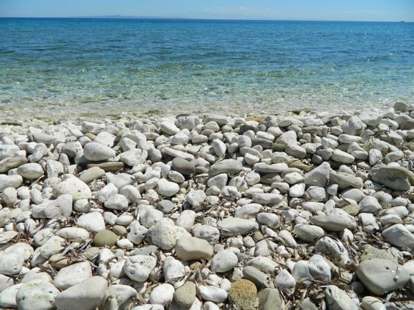 white stones and blue water