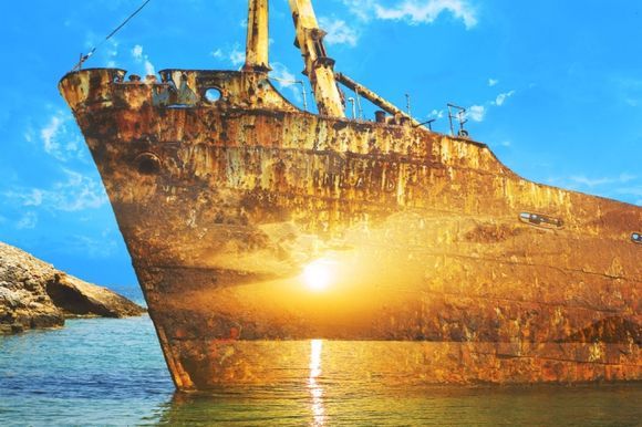 Amorgos, Liveros bay : old boat reflecting sun...