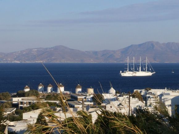 The windmills and on the background the island of Tinos