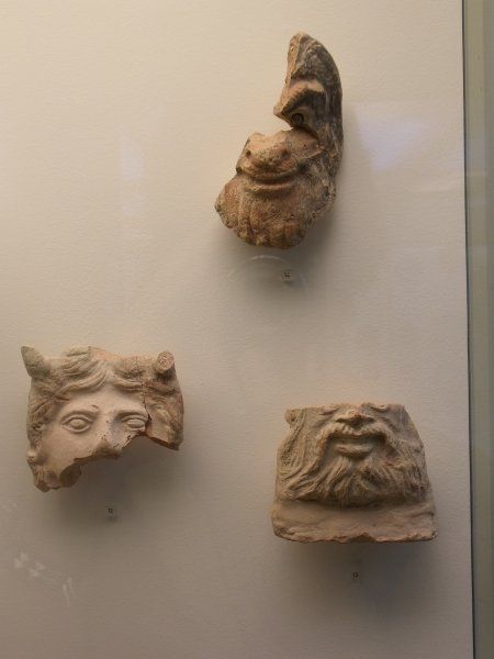 Terracotta masks, depicting satyrs, in the archaeological museum. (July 2013)