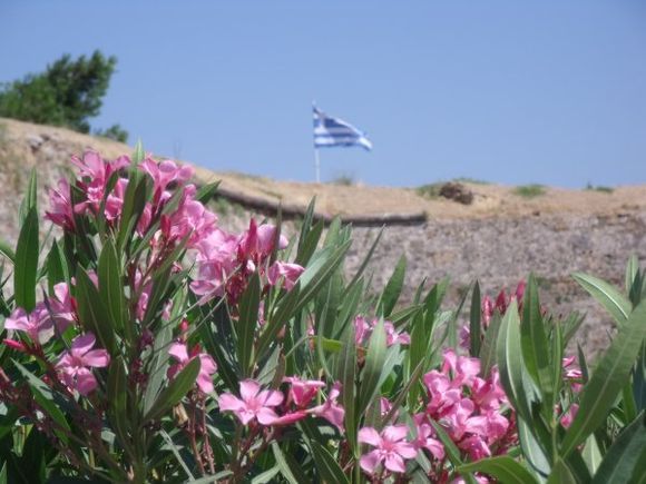 Greek flag flaunting atop the castle. (July 2013)