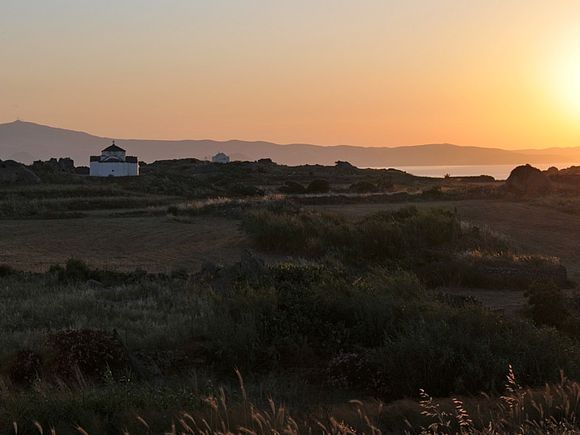 Agias Kyriakis between Sangri and Vνvlos at sunset