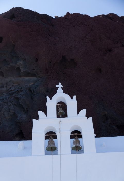 View of Ayios Nikolaos church near the red beach. Great contrast between the roch and the white colour of the church