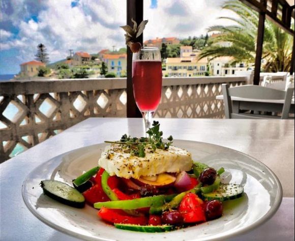 A Greek salad with a beautiful view from Panormos Restaurant in Fiskardo Kefalonia