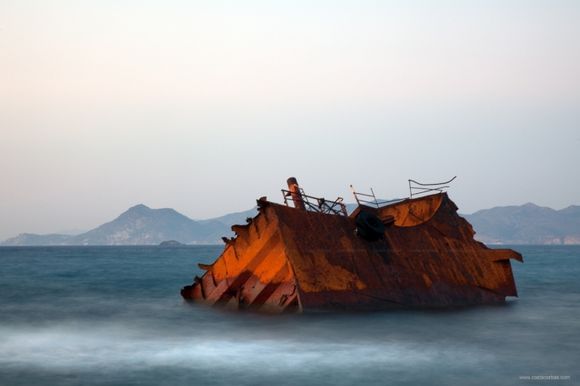 Wrecked ship at sunset. Sarakiniko, Milos Island, Greece.