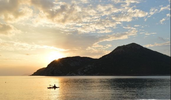 Enjoy canoeing at sunset..