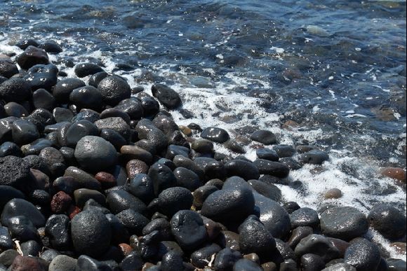 Sea & Rocks: volcanic boulders.