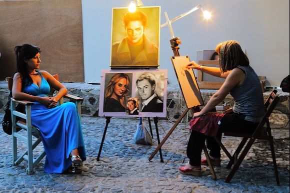 Santorini\'s tourists: The magic of portraiture.