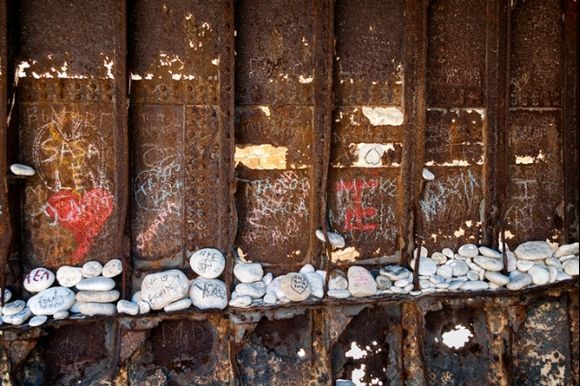 Memory stones inside shipwreck on Navagio beach.