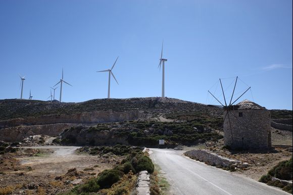 Modern wind turbines and old windmill near Koronos.