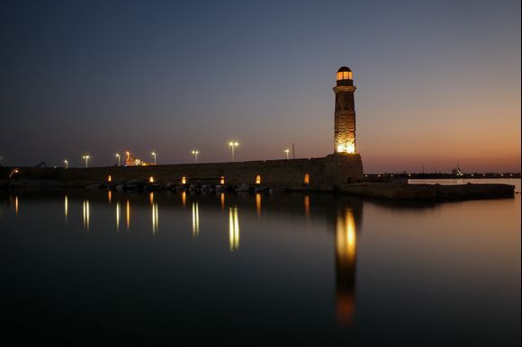  Lighthouse in old harbour by night.