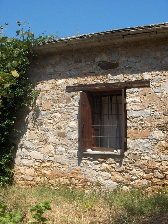 window of old house next to damouxari beach, Pelion