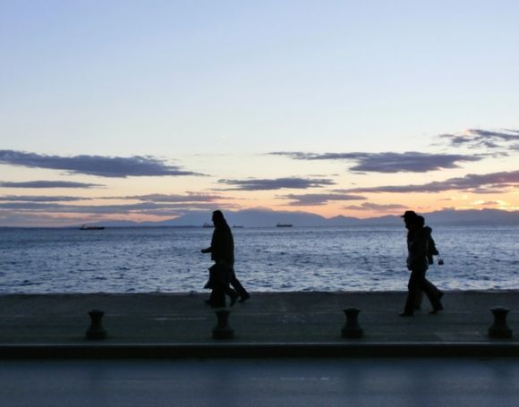 walking next to the sea at evening