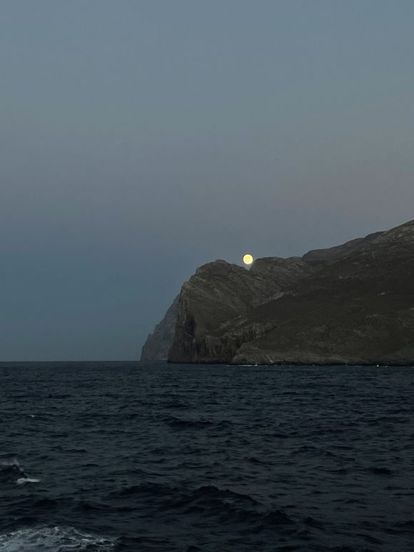 moon rising behind the island of Amorgos